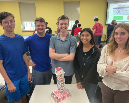 First-Year CEC students build a card tower.
