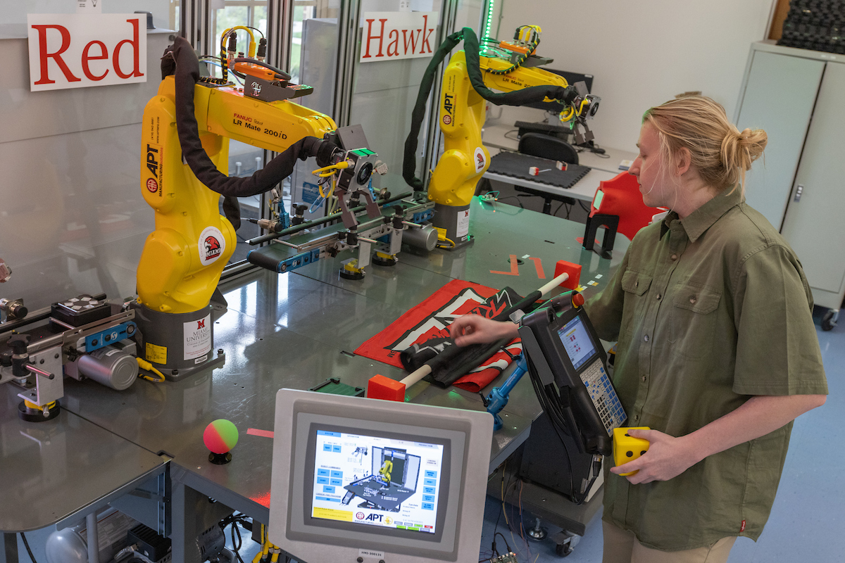 A student works on her 2022 Senior design robotic project.