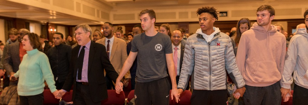 students holding hands