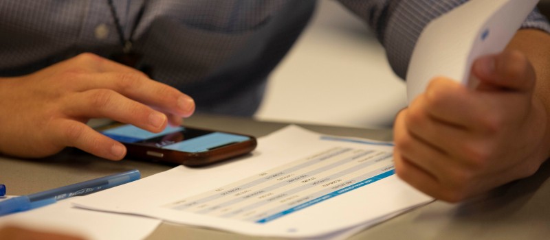 hands tapping smart phone