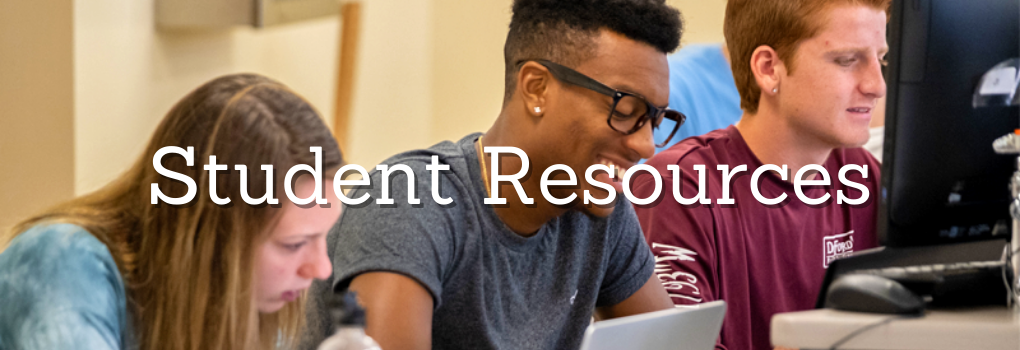 three students on computers