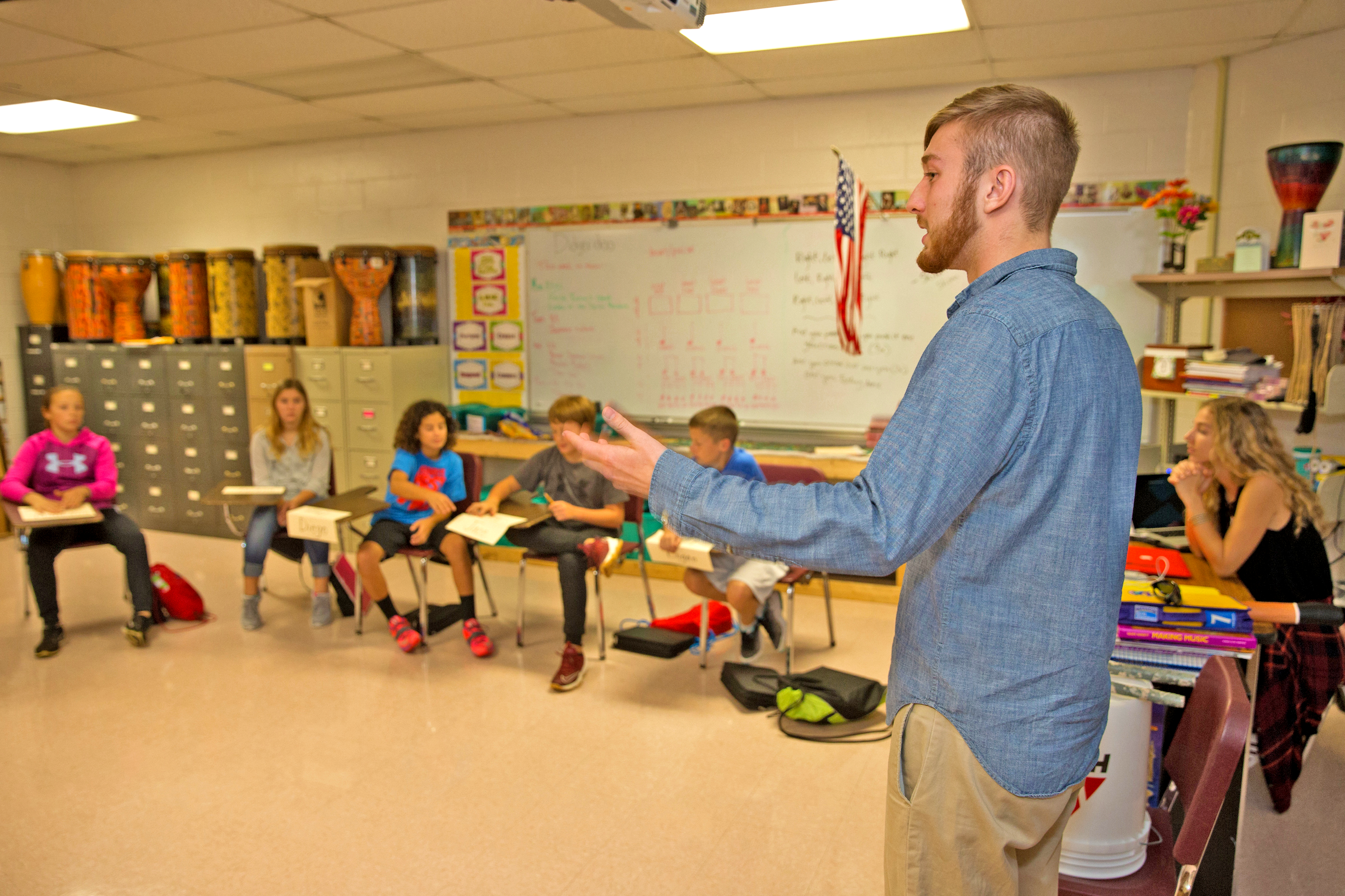 student teacher presenting in front of a classroom