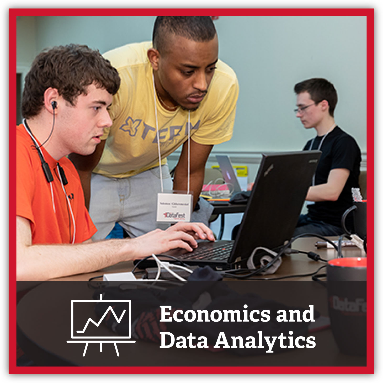 Students reviewing data on a computer. Economics and Data Analytics.