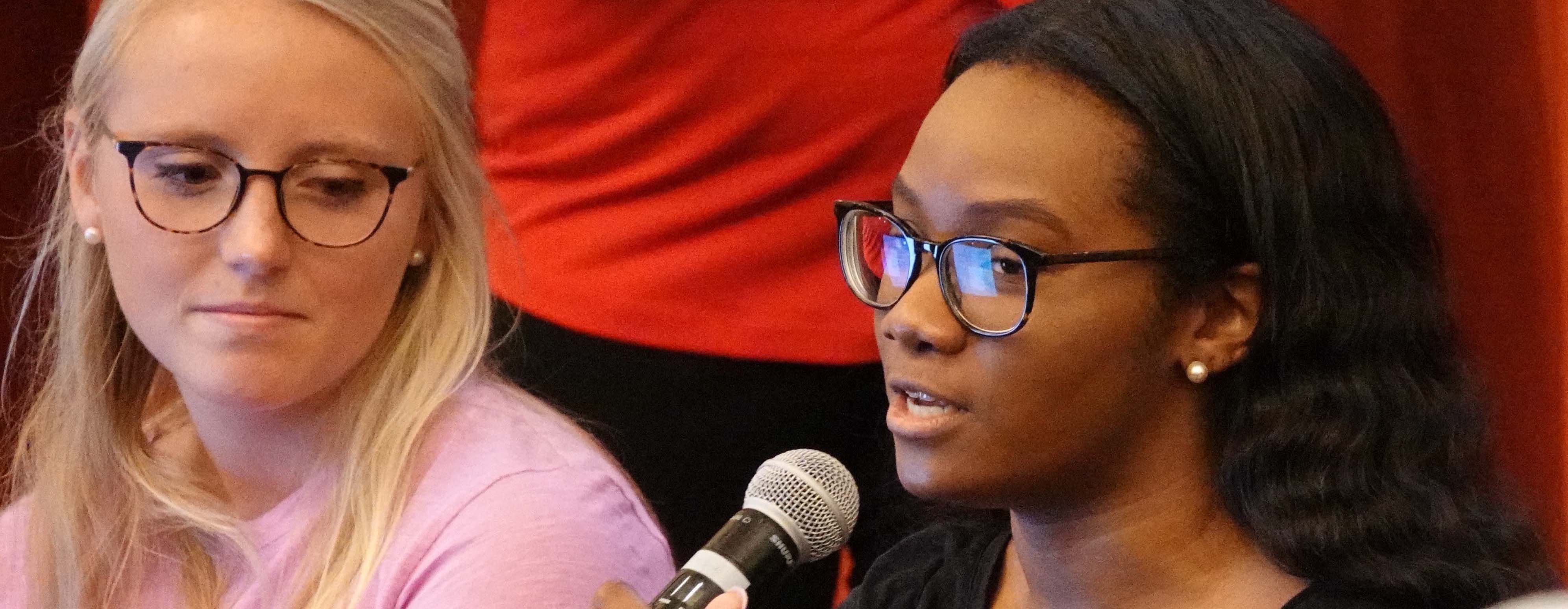 Upperclassman responds to a question at a freshman orientation class