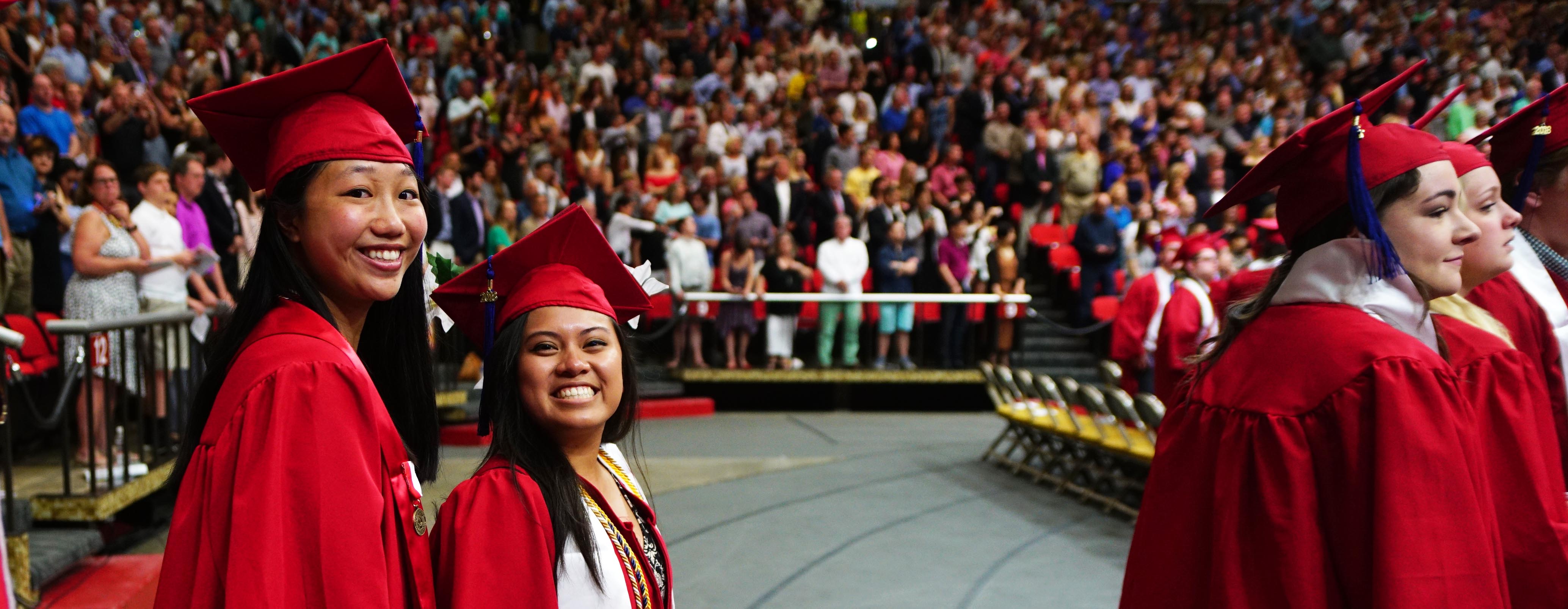 Students smile for the camera and their families at FSB recognition ceremony