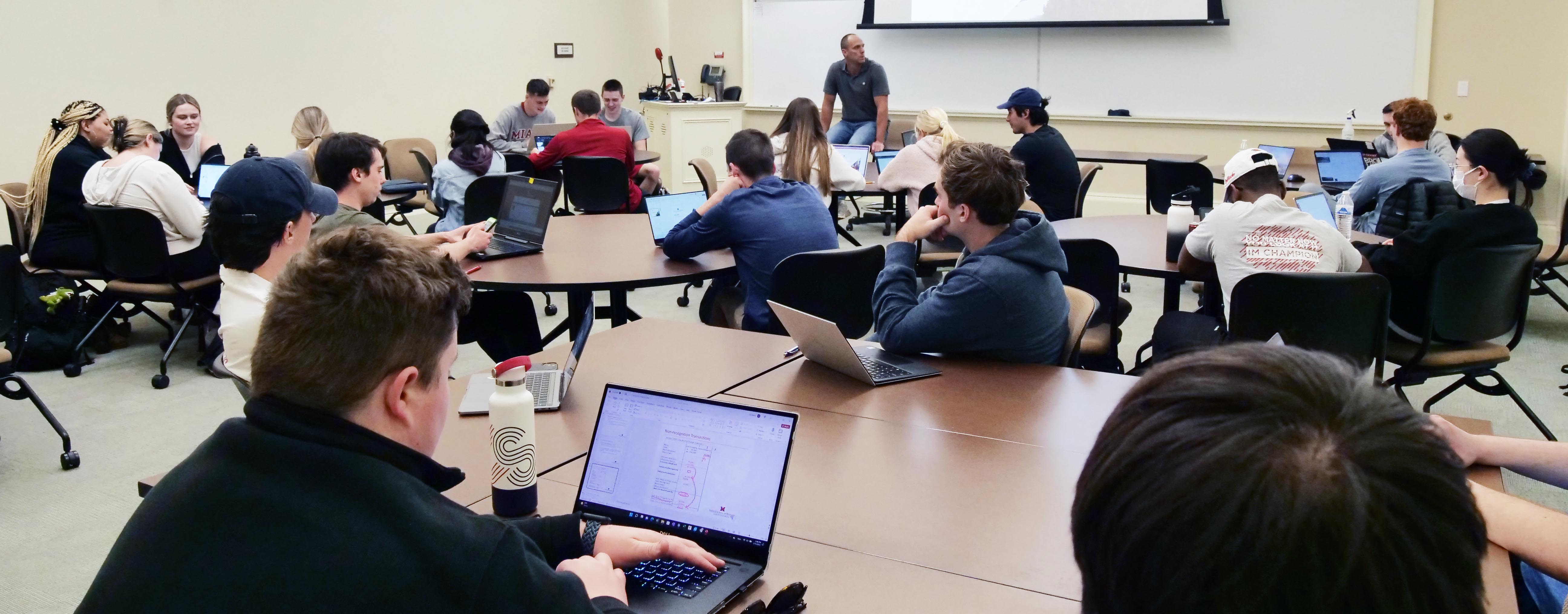  Wide photo of Billy Brink teaching an accounting class