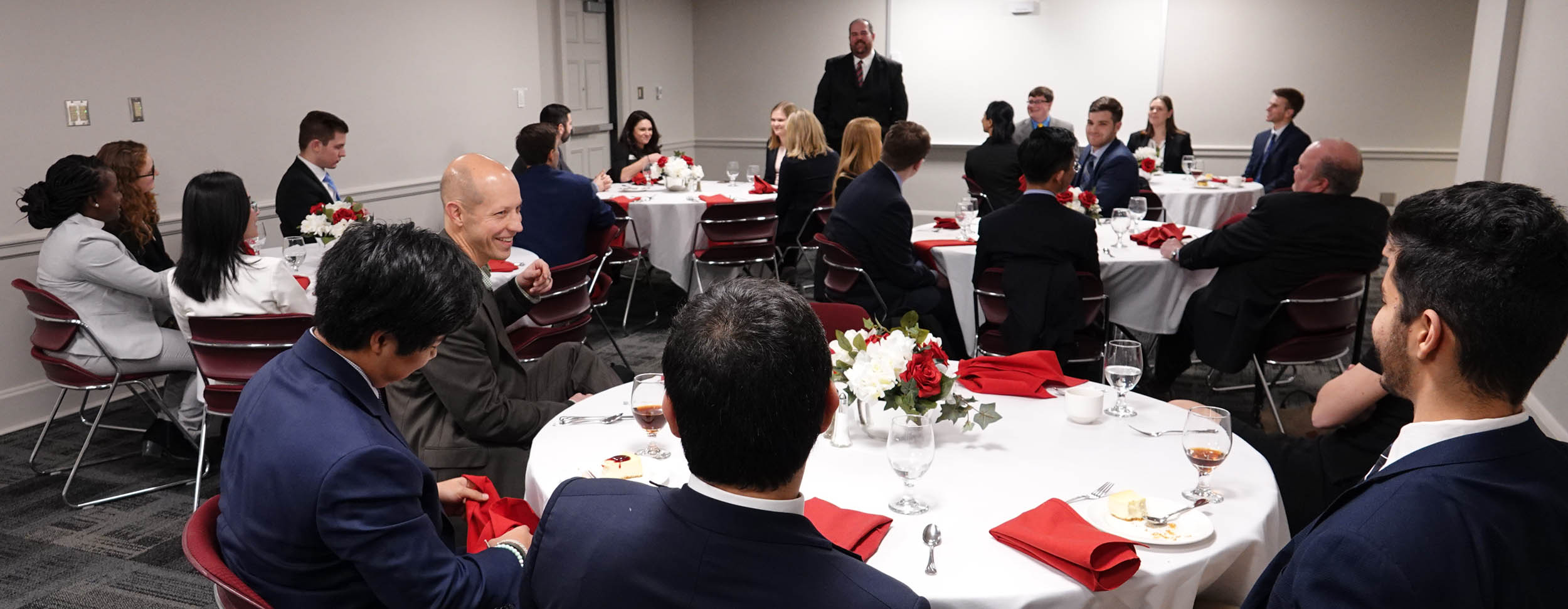 Jon Grenier addresses participants in the William Millett case competition