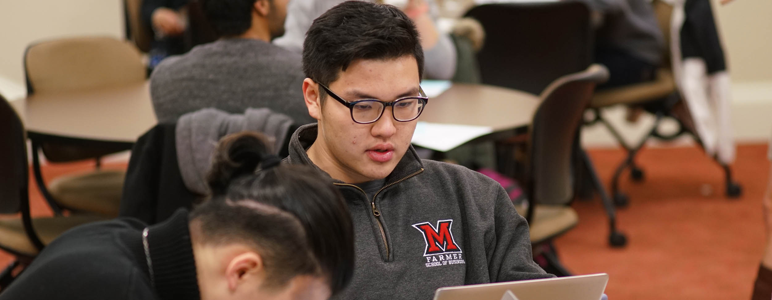  Student looks at his laptop during class