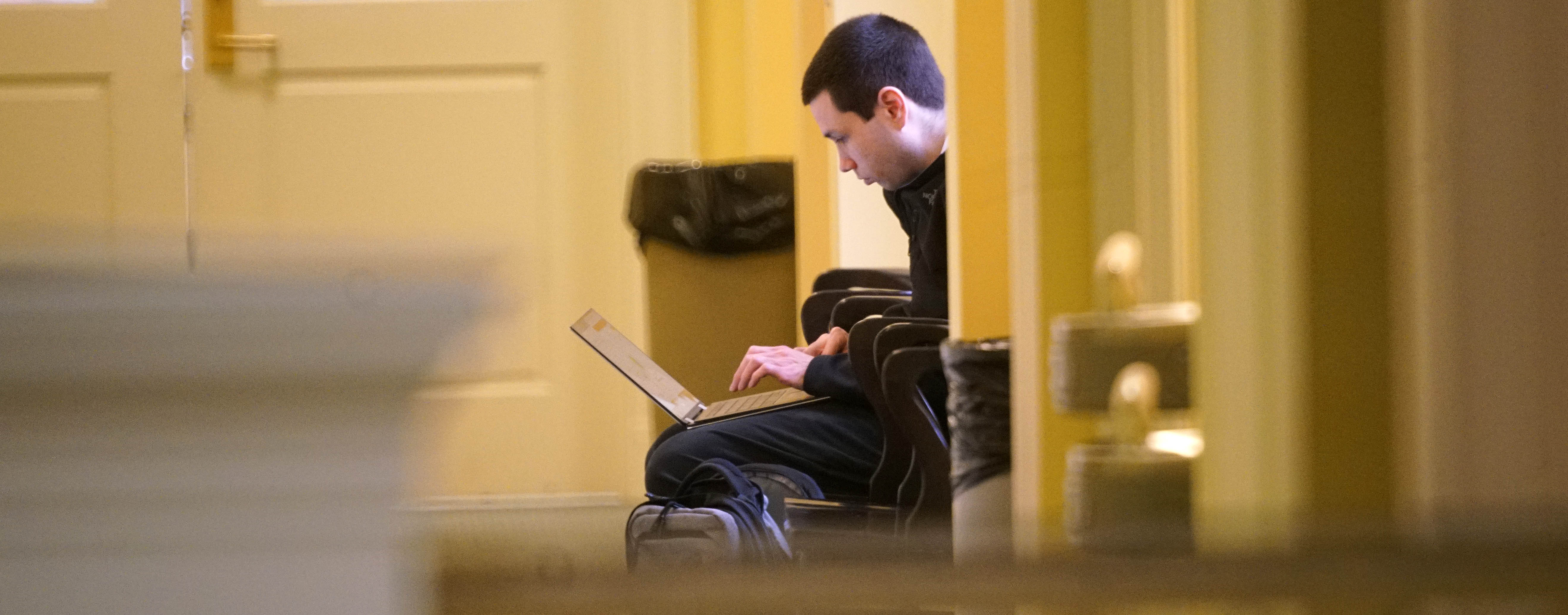Student studies in hallway on second floor