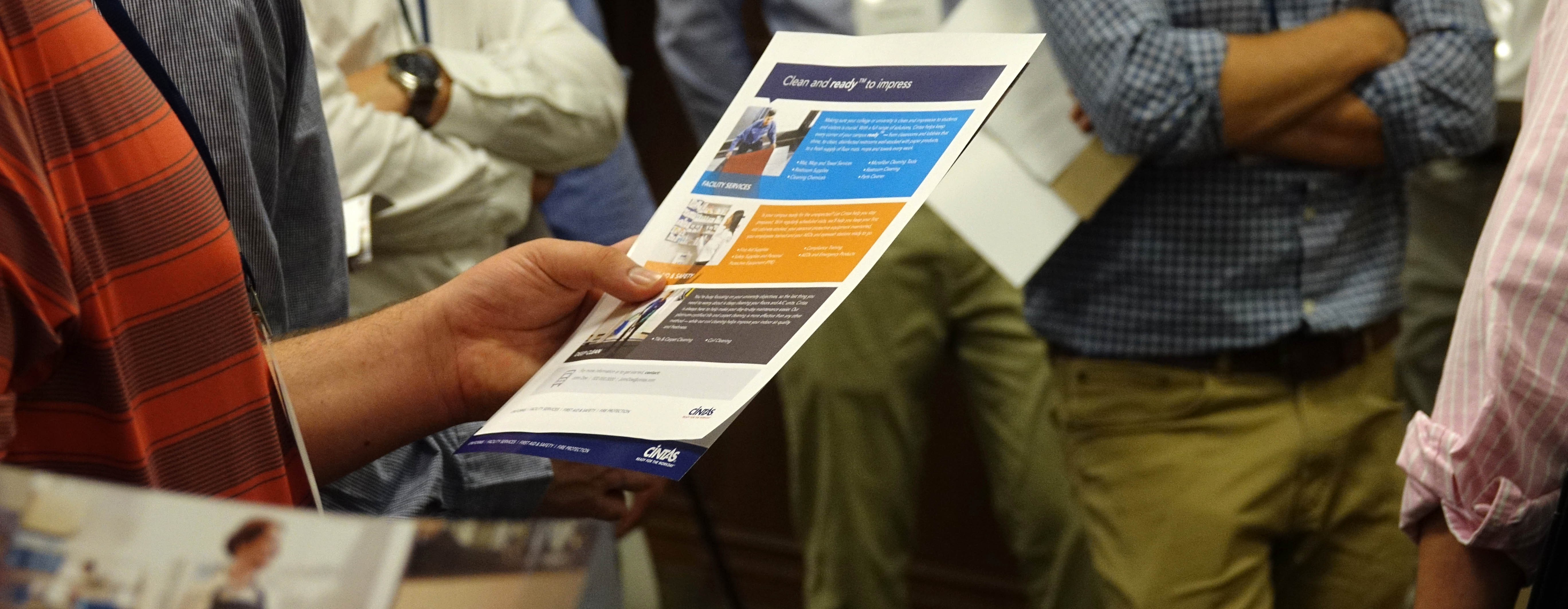 Student holds Cintas brochure