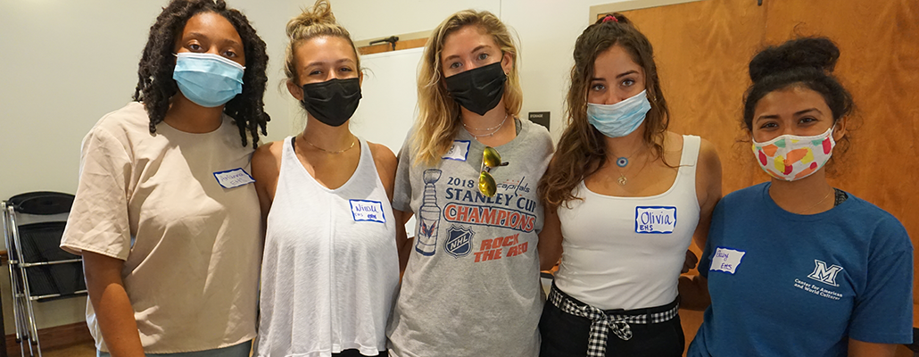  Group of EHS students wearing face masks pose in MacMillan Hall