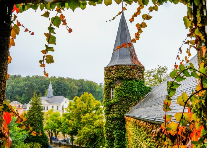 beautiful photo of the MUDEC chateau, see the top of the castle, mostly green and yellow ivy