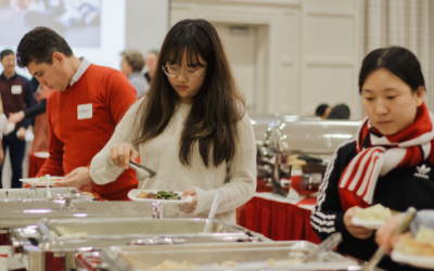 students take food from a buffett line
