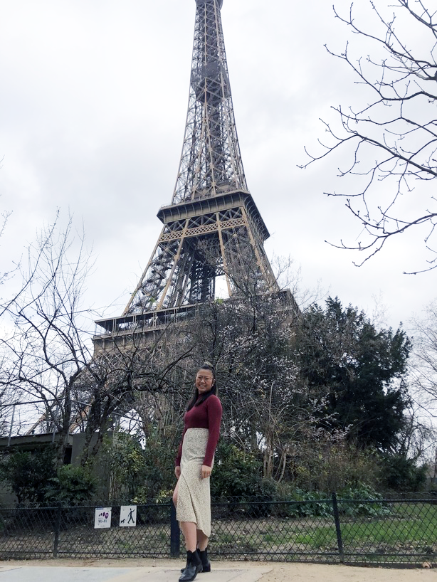 Serena Lanum poses in front of the Eiffel Tower