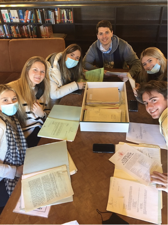 Students working in the MUDEC archives