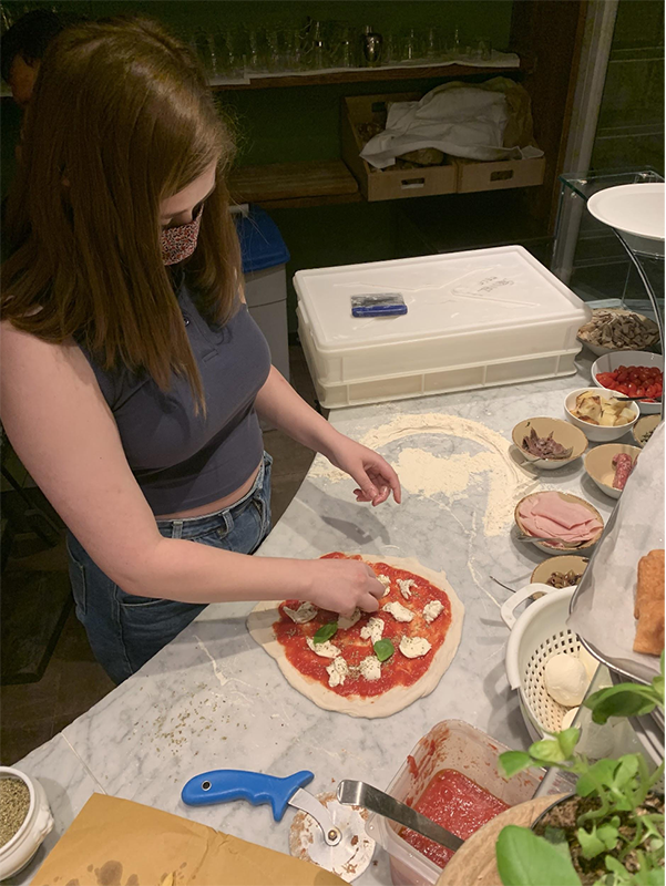 Paige makes a pizza