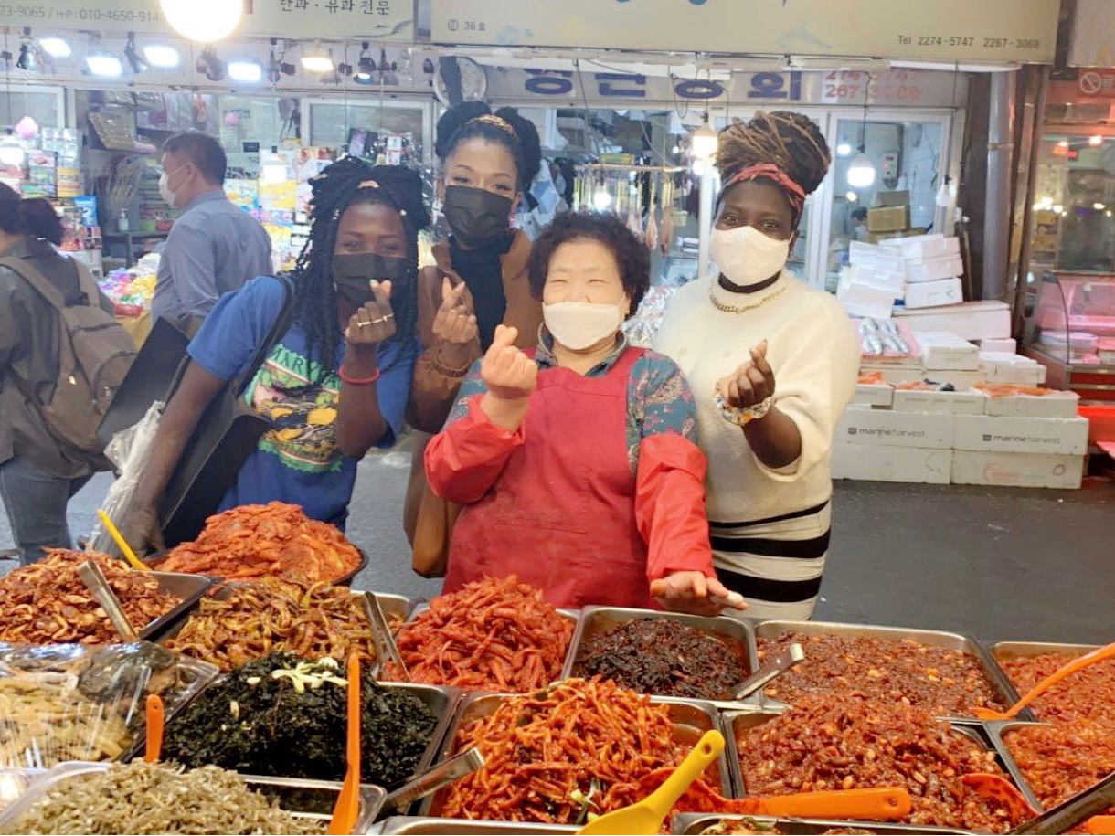 Sinait and friends at a traditional Korean market