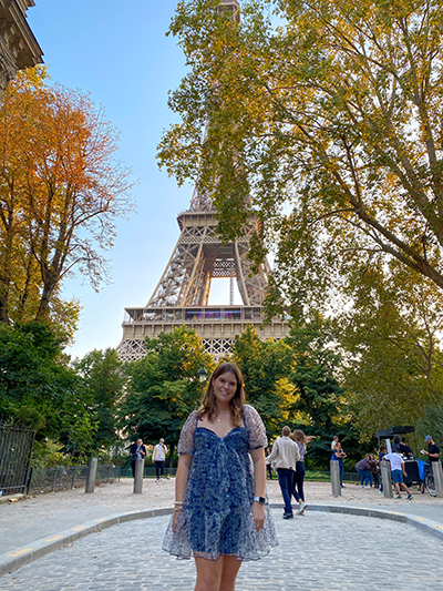 Sydney poses near the Eiffel Tower