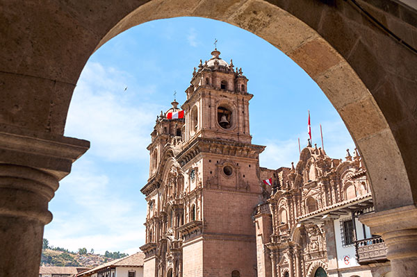 Classic Peruvian architecture viewed through a building archway
