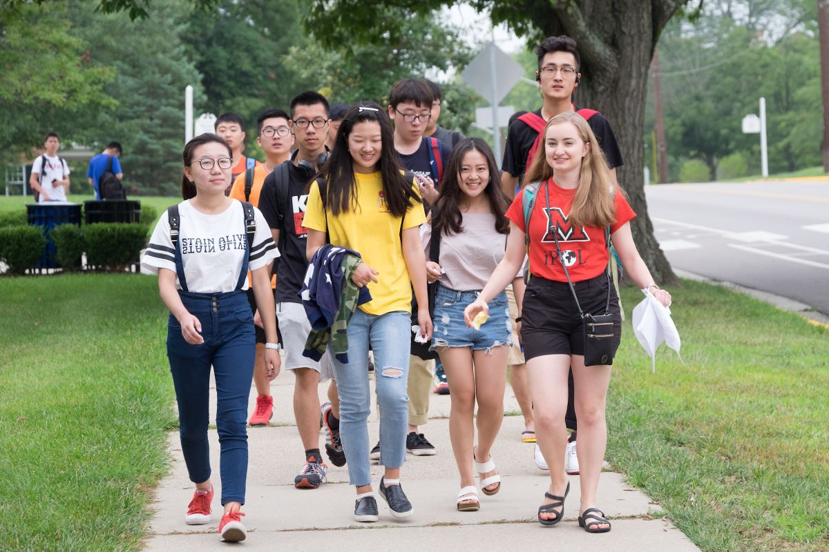 students walking with a tour guide during orientation