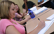Girl taking notes during class