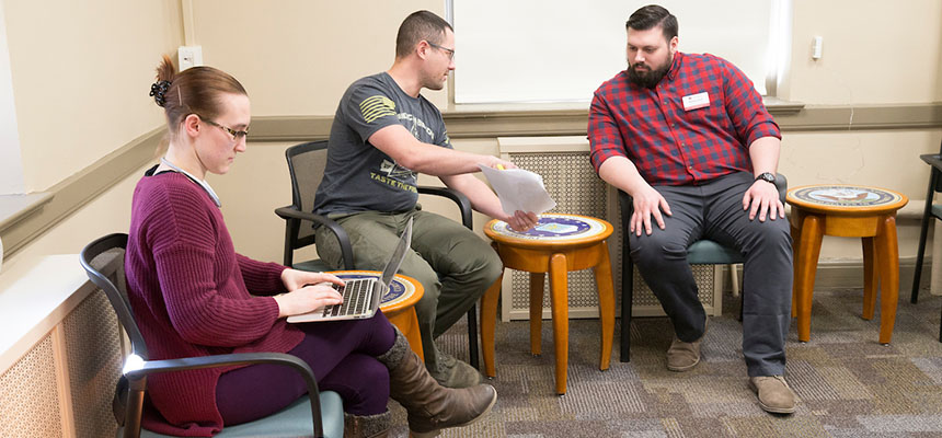 A veteran speaks to an advisor at the Veteran Students' Center