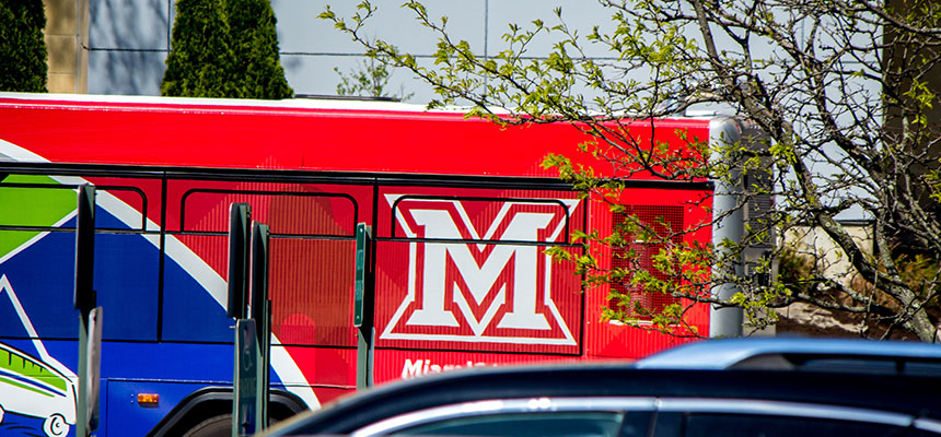 The back of the transit bus with a red Miami M.
