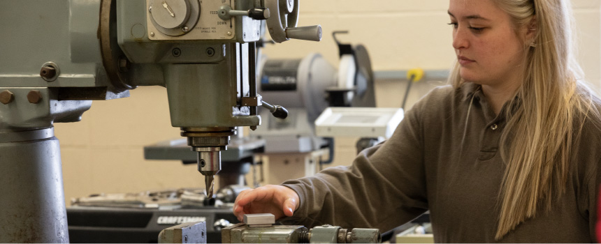 Student working with a piece of robotics equipment in the ENT lab.