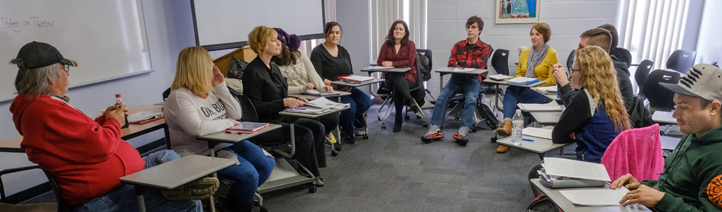 A class sitting at their desks in a circle