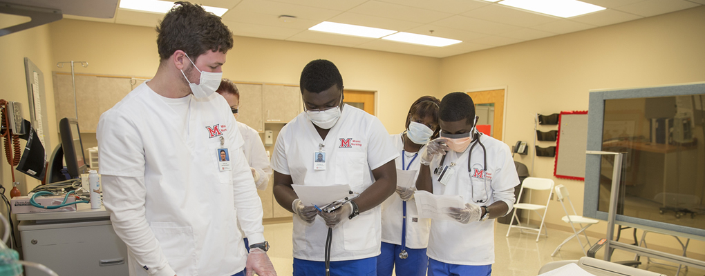 Nursing students working together on a task