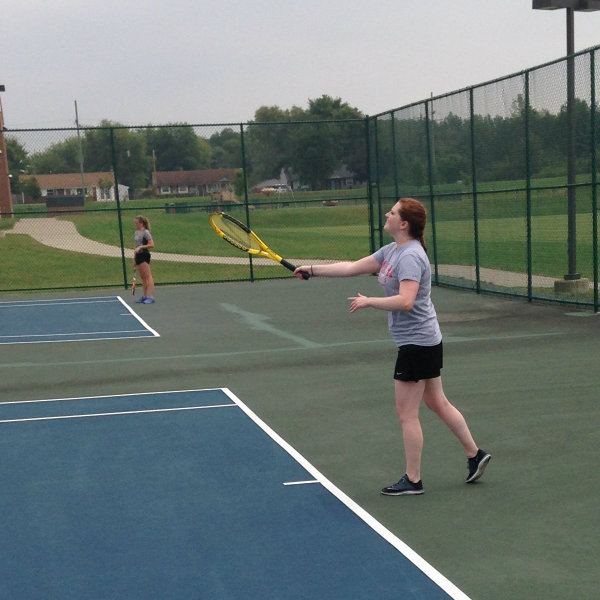 Women's Tennis Athlete Serving