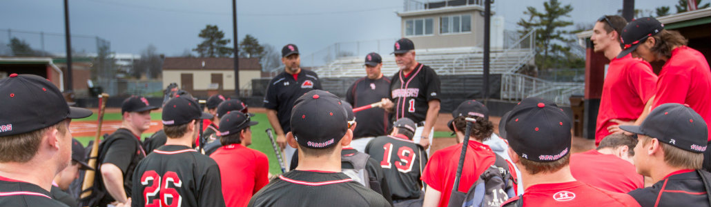 Miami Hamilton baseball team in a team huddle after the game