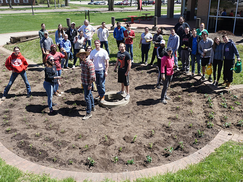 Students working in the rain garden.
