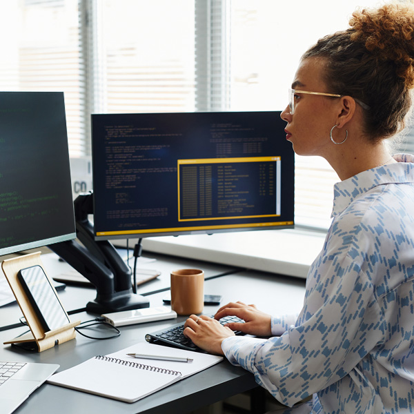 A woman who working on software code