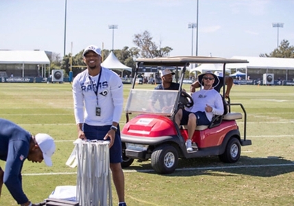 A'mon Yisreal helping to set up a tent at training camp for the LA Rams.