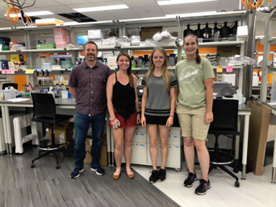 (left to right) Matt Saxton, EEEB Ph.D. candidate Carly Prochazka, and Applied Biology majors Helena Hitch and Emma Jones