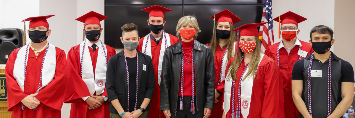 Green Zone Grads Ceremony graduates with Dean Cathy Bishop-Clark