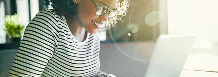 woman typing on a laptop