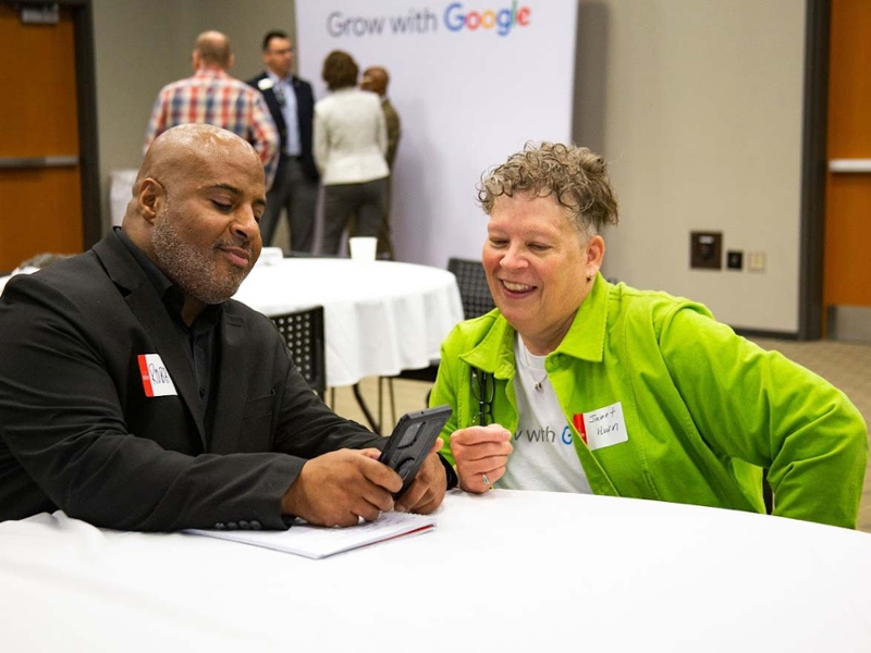 Grow with Google Digital Coach Janet Hurn working with Robert Henderson, business manager for Mz. Jade's.