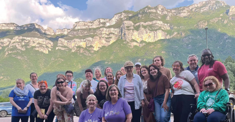 European summer student group in front of the mountains in Austria.