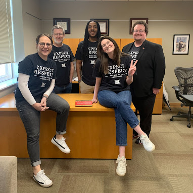 The Dean of Students staff - Kimberly Moore, Tim Parsons, Alex Wood, Ben Williams, and Lyndsey Tonyan - posing in Expect Respect shirts.