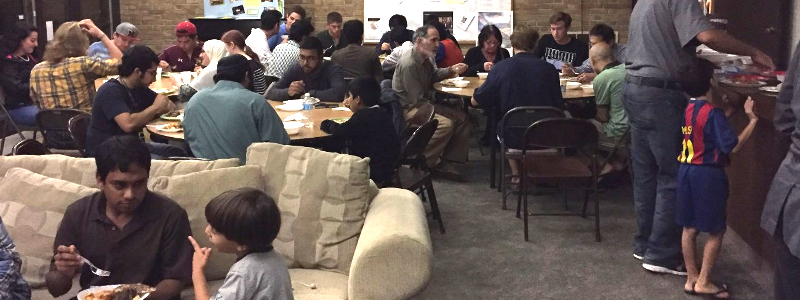  Muslim students and families gather for a meal to celebrate Eid