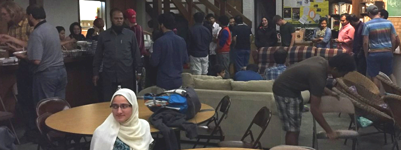 Muslim students and families line up for food at an Eid celebration