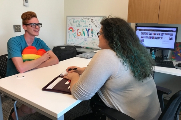 Hannah Thompson, Associate Director of LGBTQ+ Services meeting with Blaze Kissell LGBTQ+ Services Student Intern