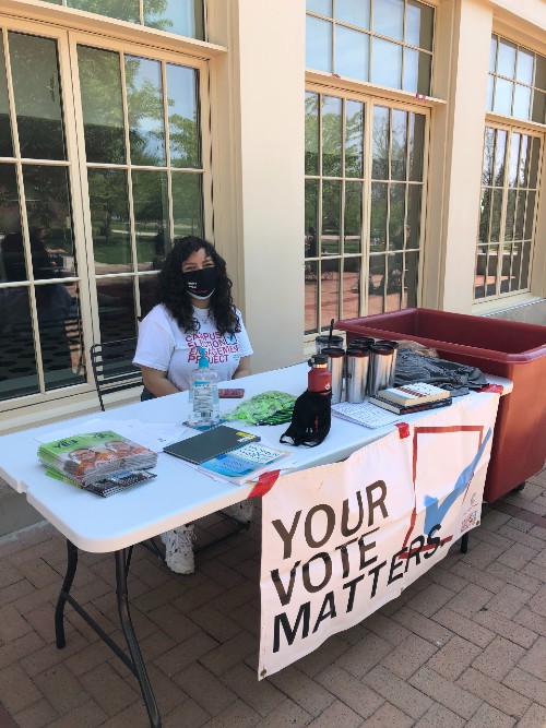 CEEP representative tabling, sign that says "your vote matters"