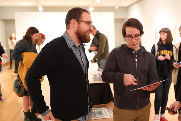 Students discuss art work in one of the galleries