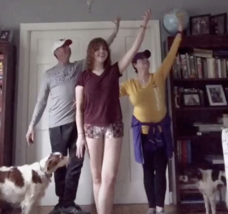 Miami student doing interpretive dance with her parents at home