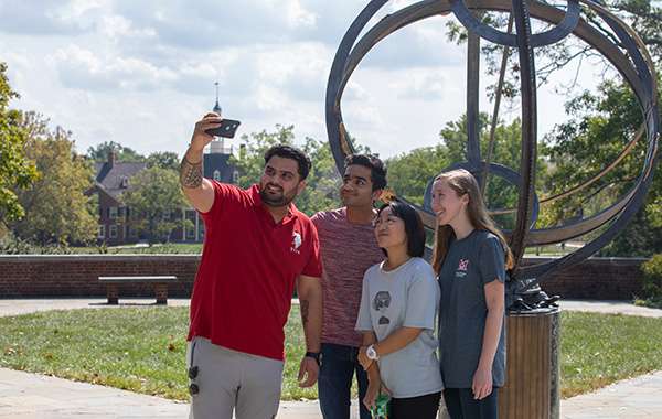 Students taking a selfie at the Sundial
