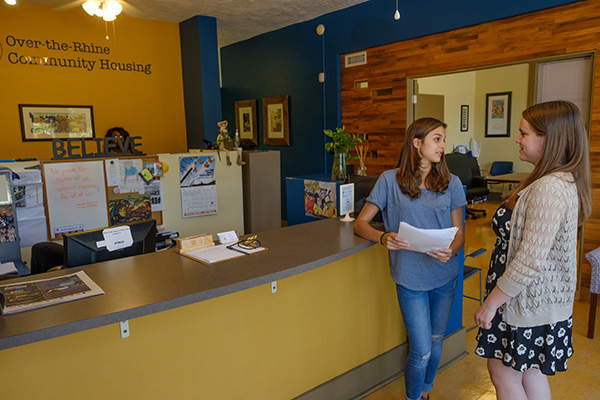  Two students working at local housing agency