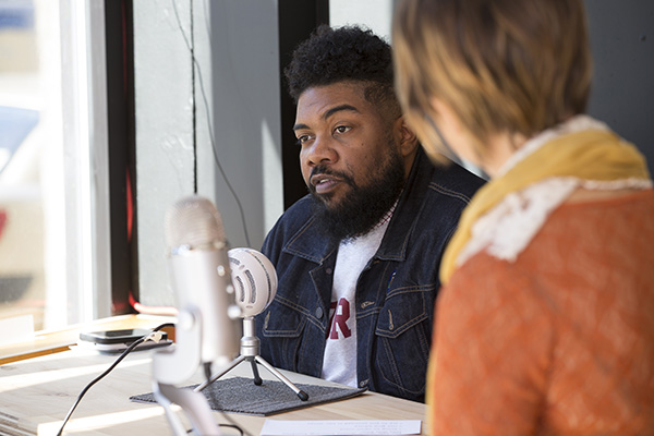  Two students presenting a podcast